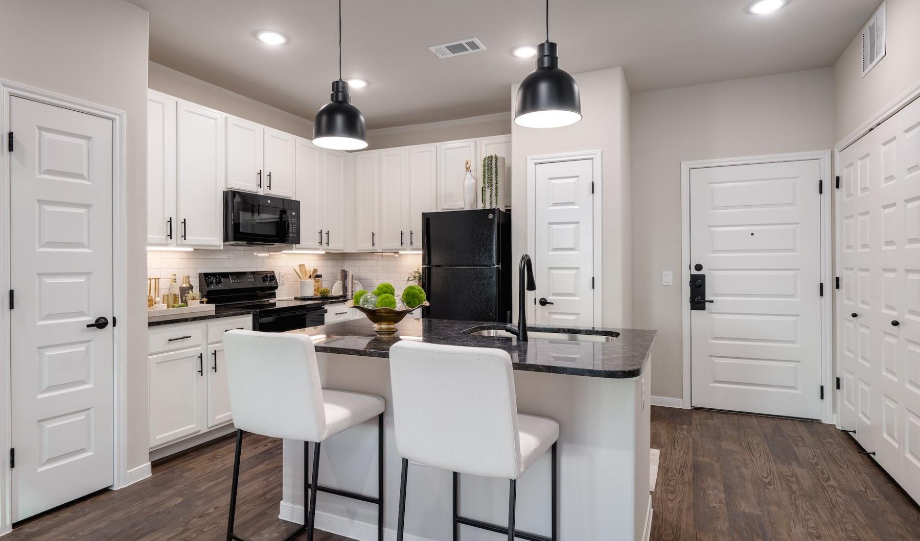 Kitchen with Island, white cabinets and black granite