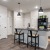 Kitchen island with barstools and desk. 