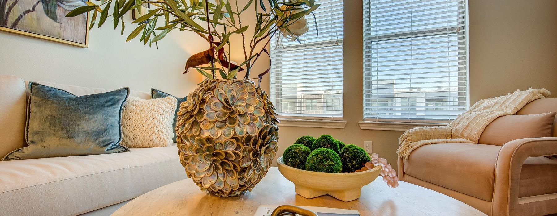 a vase with flowers on a table